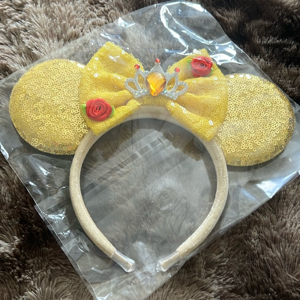 Bought for a Disney trip and never worn. Still in the plastic package.